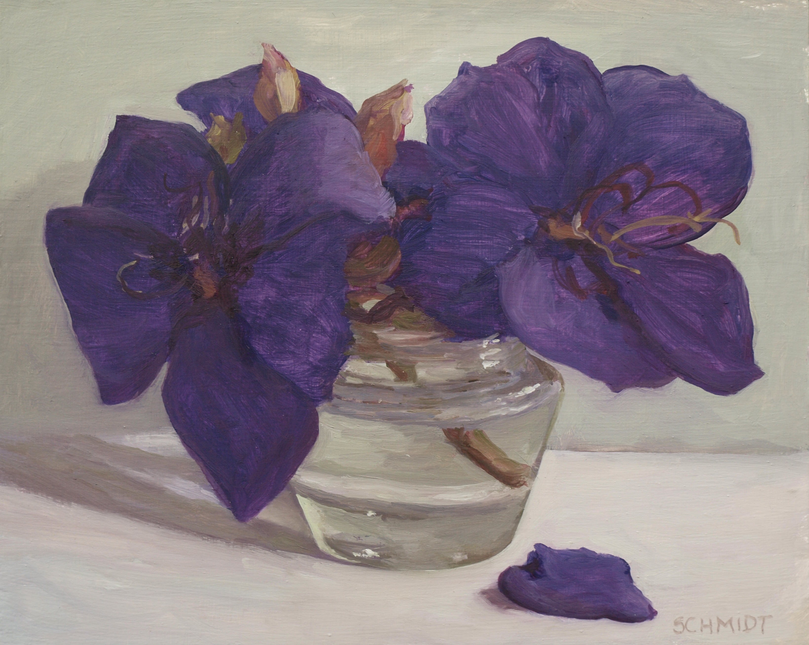 purple flowers in clear vichy jar with escaped petal