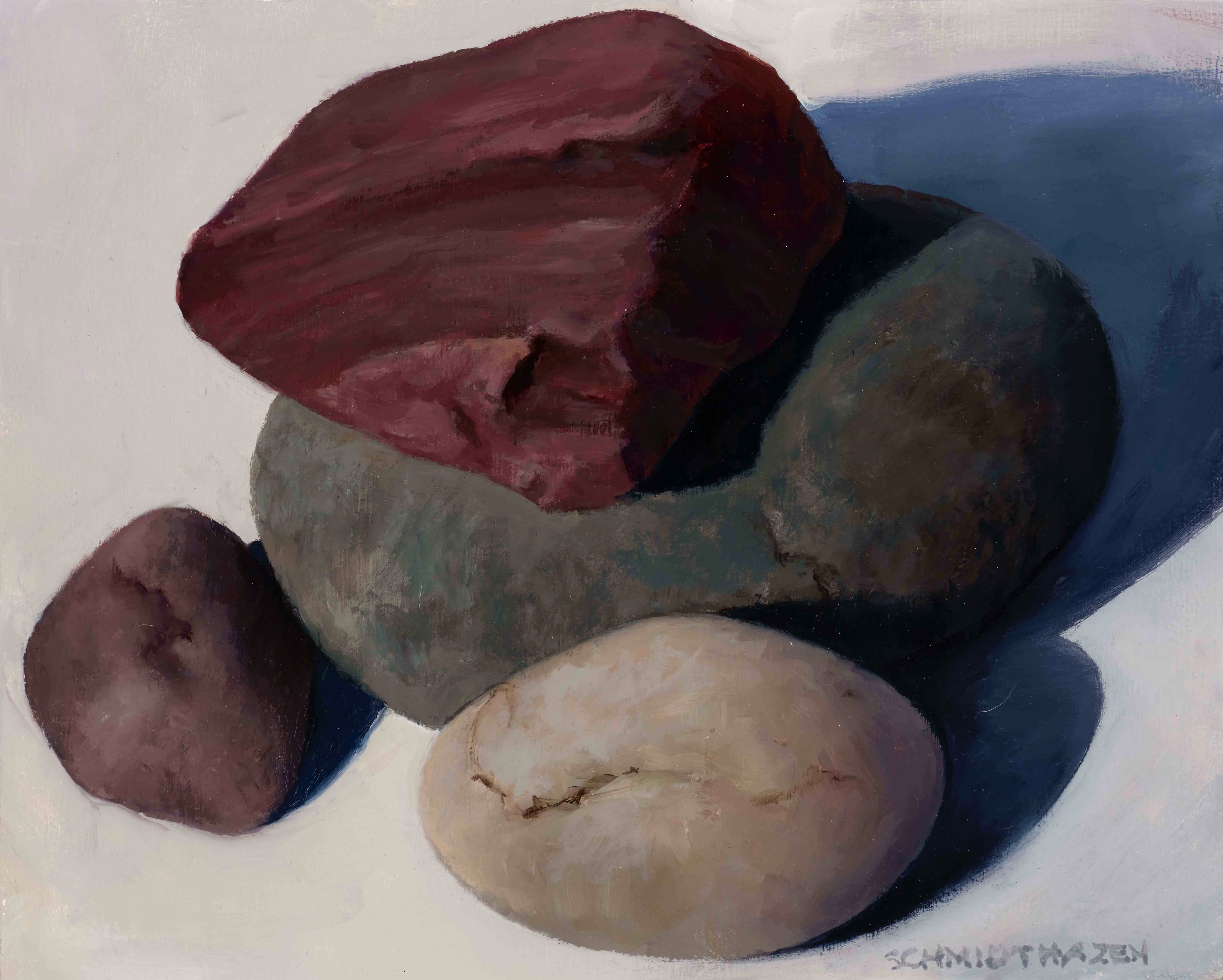 four different colored rocks and shadows