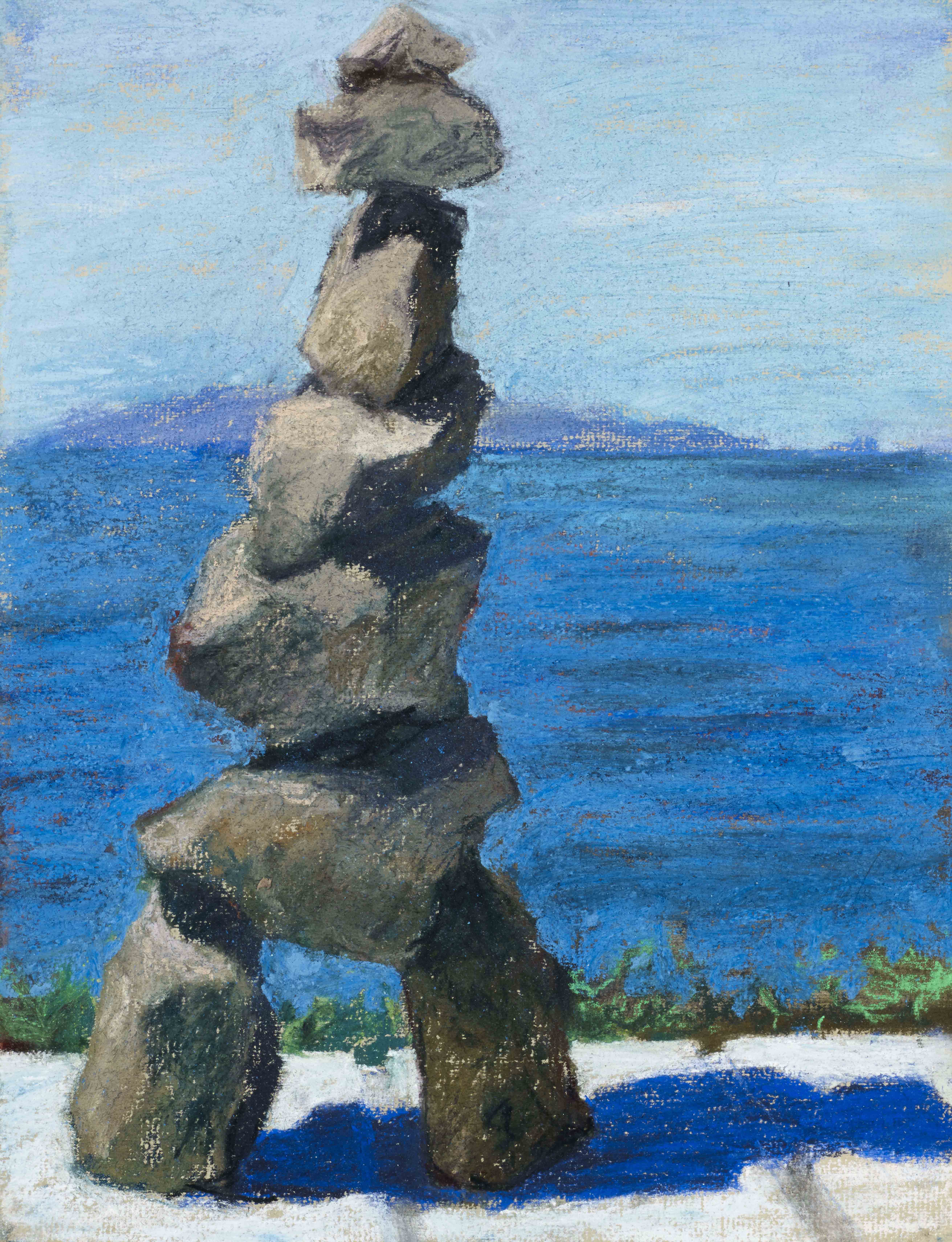 eiffel tower type rock stacking blue sky behind